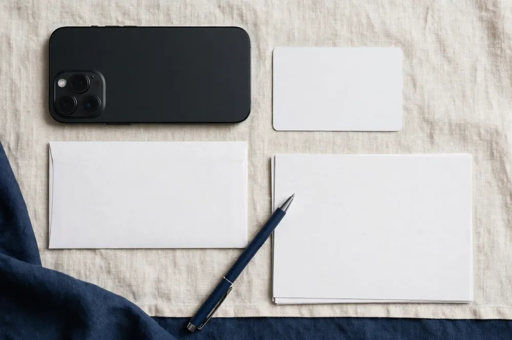 Documents and a phone on a desk, ready for a Lifeline free iPhone application